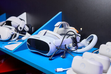Futuristic Virtual Reality VR Headsets are prominently on display in a Tech Showcase event