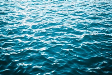Obraz premium Light blue water surface with ripples and reflections, top view, flat lay, isolated on a light background,