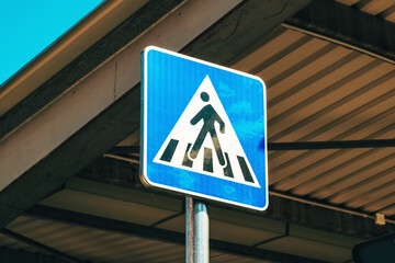 Pedestrian crossing sign on urban parking lot