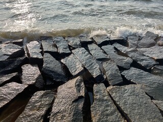 Interlocking Stones Against the Sea
