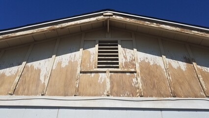 Working on Aged House, Run Down Peeling Paint on Wood, Prep Work on Exterior