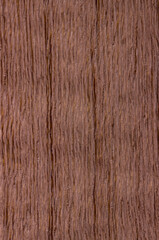 Obraz premium texture of wood. wooden board, eclological material. artificial wooden coating, from recycled materials,beautiful texture, light, brown, view from above. vertical texture.
