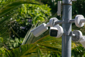 Security cameras mounted on pole outdoors