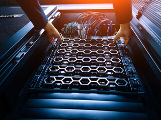 Hands Installing Server Components in Rack