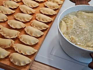 Classic pierogi are cooked in water, stuffed with cabbage and mushrooms.