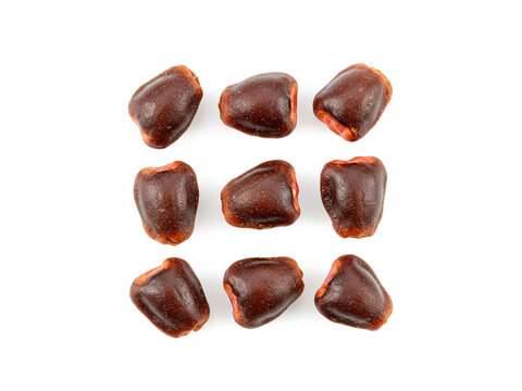 Tamarind seed top view isolated on white background.