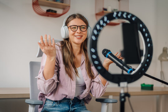 Influencer creating engaging content with ring light and microphone