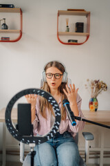 Content creator recording a podcast using ring light and microphone