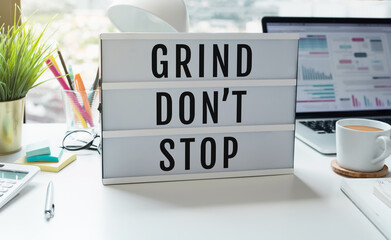 Business motto with text Grind Don't Stop.Motivation and performance
