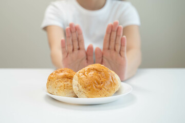 Woman choose to avoid to eat sweet and food that have high carbohydrate.