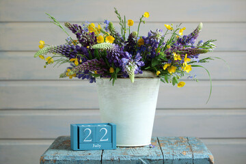 Bouquet of wildflowers celebrating july 22nd on rustic wooden table