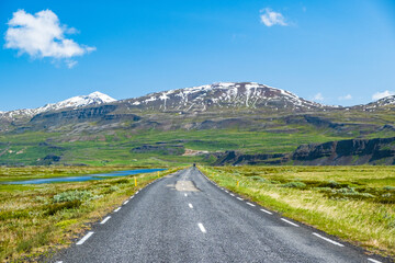 Road and snow covered mountains in North East Iceland
