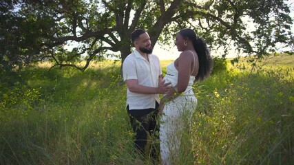 Captivating and enchanting moments of a couple joyfully celebrating their enduring love in a serene and picturesque outdoor setting, featuring stunning natural beauty and intimate, heartfelt poses
