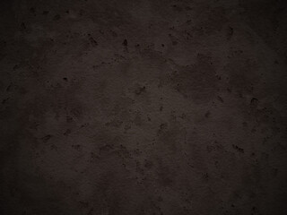 Deep brown cement texture featuring light scuffs and uneven tones across the surface.