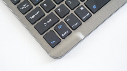 Black wireless computer keyboard isolated on white background