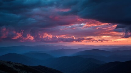 Obraz premium A Dramatic Sunset Over An Expansive Mountain Range