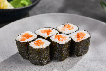 Salmon hosomaki sushi rolls, bright lighting, overhead composition Japanese restaurant menu
