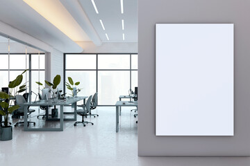 Vertical white canvas mockup on gray wall inside modern luxury office interior with glass windows, plants, and corporate workspace desks. 3D Rendering