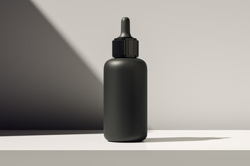 Black dropper bottle mockup standing on white surface with angled sunlight and shadow for cosmetic...