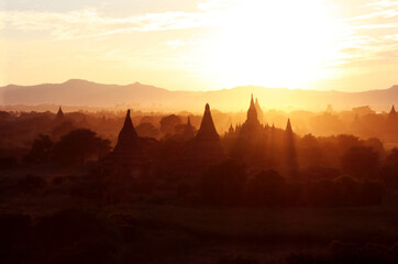 Aerial view on temples in the Archaeological Zone in sunset light, Bagan, Myanmar. Top view on...
