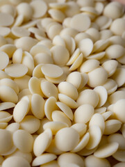 White chocolate chips Pistols buttons. Confection and pastry concept.