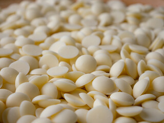 White chocolate chips Pistols buttons. Confection and pastry concept.