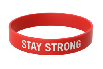 Red silicone bracelet showing stay strong encouraging message on transparent background