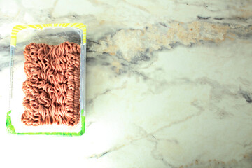 plastic container with minced meat on the table top view meto for copyspace text