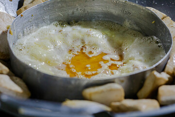 Cooking Process of Frying Tofu Pieces and Egg in a Traditional Wok