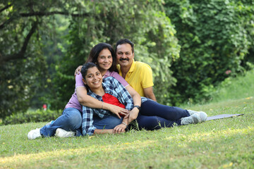 Fototapeta premium Indian happy family fun at park