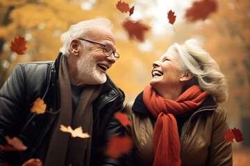 Golden hour in autumn with a happy elderly couple walking together

