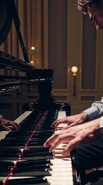 Close-up of pianist&rsquo;s hands performing on grand piano during live classical music concert, symbolizing fine arts, musical talent, professional musician, and refined artistic expression
