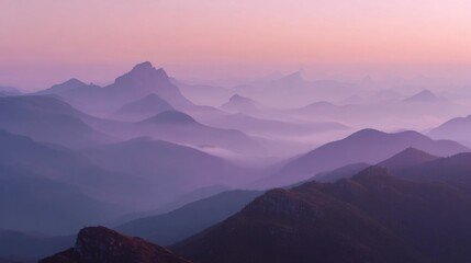 A Mountain Range With The Soft Hues Of Dawn