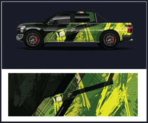 Modern Pickup Truck with Abstract Green and Black Camouflage Wrap Design © MdAbdullah