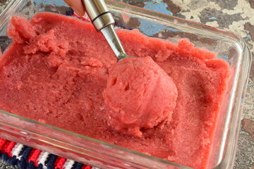 Homemade raspberry sorbet , scoop of raspberry ice cream