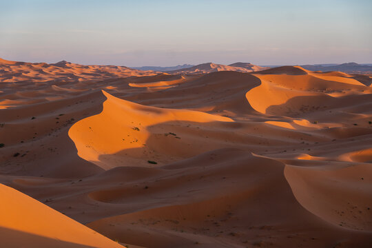 Merzouga, Morocco: Panoramic view of the sunset over the Merzouga from the Erg Chebbi sand dunes in the the Sahara desert in Morocco