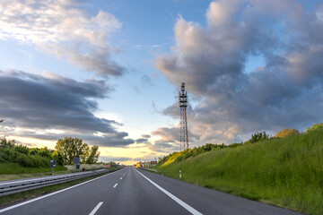 Sunset road. Evening landscape. Empty highway