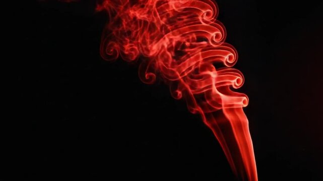 Swirling Red Smoke Against Black Background in Slow Motion