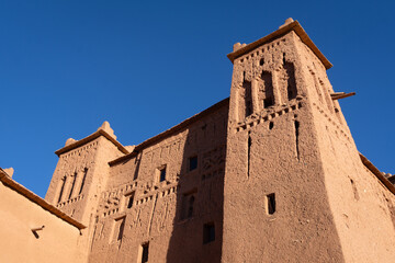 Ouarzazate, Morocco: The kasbah in the Aït Benhaddou fortified village near Ouarzazate in the Moroccan atlas with a dark blue sky.