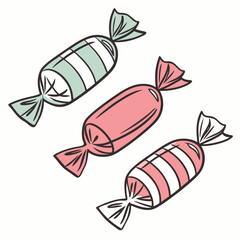 Three delicious candies wrapped in colorful papers on white background