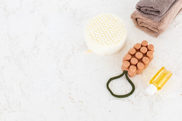 Towels with body care products on the white background.