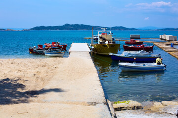 Fototapeta premium Sea panorama, with boats at Athos, Greece
