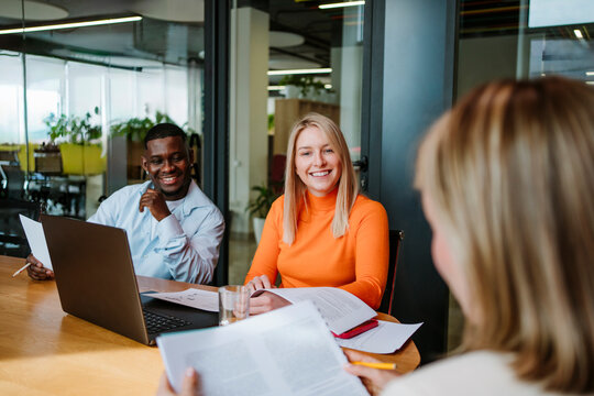 Colleagues having a business meeting in a modern office