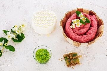 Spa products for facial and body care with soft terry towel.