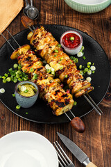 Skewers with fried young potatoes with bacon