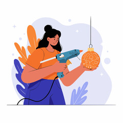 Young woman using a glue gun to decorate an ornament indoors  