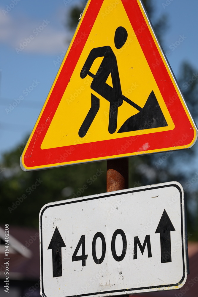 Aufkleber a close-up view of a street sign on a pole, with clear text and a simple design