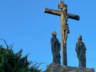 The Lord Jesus on the cross and two women under the cross in the garden at the Minor Basilica of...