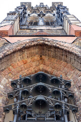 Bells in gothic arch. Upward view. Historic tower