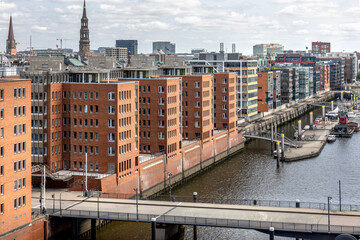 Urban architecture. Canal and bridge. Brick facades.